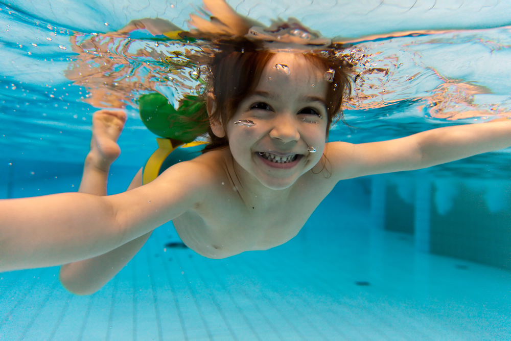 Child enjoying custom swimming pool